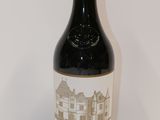 a bottle of wine that is sitting on a table