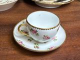 a cup and saucer sitting on a table