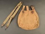 a close up of a bag and a pair of scissors on a table