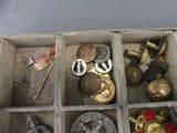 a box filled with assorted metal items on a table