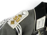 a close up of a military uniform with a badge on it