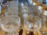 many glasses and cups on the table ready to be used