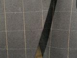 a close up of a suit with a tie on it
