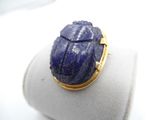 a picture of a ring with a scarab on it