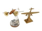 pair of metal airplanes with wooden bases on a white background