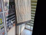 a poster on the easel in the corner of the room