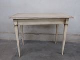 a small table that is sitting on the concrete floor