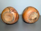 two vases that are sitting on a table
