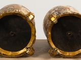 two vases that are sitting on a table