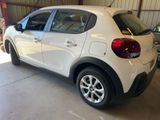 a white car that is parked in a garage
