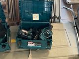 two blue tool boxes sitting on the floor next to each other