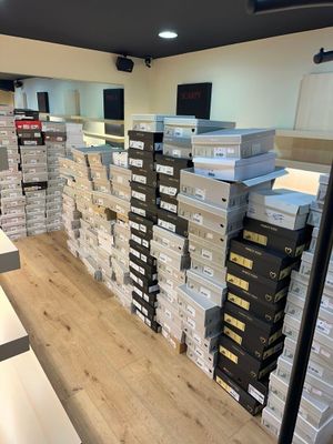 stacks of boxes stacked on top of each other in a store