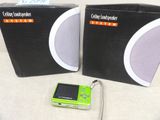 two speakers and a mp3 player sitting on a table