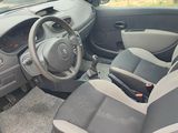 the interior of a car with a steering wheel and a dashboard