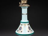 an image of a lamp with a chain attached to it ' s base