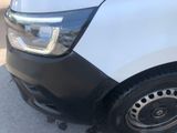 a white van parked on the side of the road