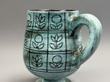 a cup that has a design on it