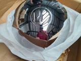 a reflection of a person in a mirror in a box