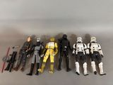 a lot of star wars action figures on the wall