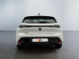 the rear end of a white car in a white room