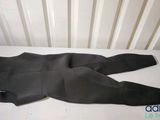an image of a black wetsuit laying on top of a white table