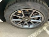 a close up of a tire on the side of a car