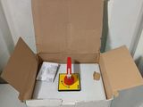 a cardboard box with a red stop sign inside of it