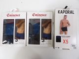 three boxes of men ' s underwear sitting next to each other on a table