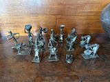 a lot of figurines that are sitting on a table