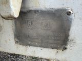 a close up of a metal plate on a machine