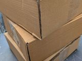 boxes stacked on top of each other on a table in a warehouse