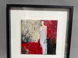 tableau encadré représentant une peinture abstraite rouge et blanche dans un cadre noir