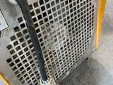 a yellow machine that has a hose attached to it