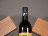 a bottle of wine that is sitting on a table