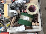 a pile of assorted tools and supplies on a table