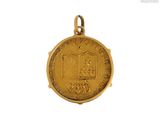 an image of a gold medal with a book on it