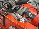 a red and black machine that is sitting on a table