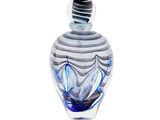 a glass vase with a blue and white design on it