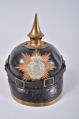 a black and gold helmet with a gold star on it