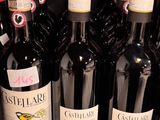 many bottles of wine on the shelf in the store