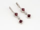 a pair of ruby and diamond earrings