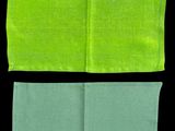 a pair of green and blue napkins sitting on top of each other