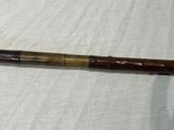 a close up of a wooden stick on a white cloth