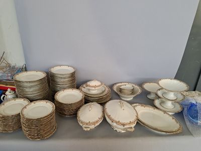 a lot of plates and bowls on the table