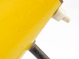 an image of a yellow table lamp on a black metal stand