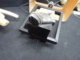 a box with a pair of shoes in it on the floor
