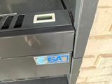 a machine that is sitting outside of a building