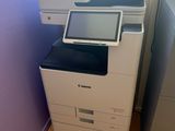 a photo of a printer and a printer scanner in a room