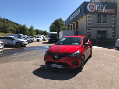 a red car parked in front of a building