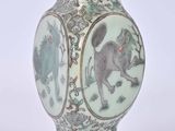 a vase that has a picture of a cat on it